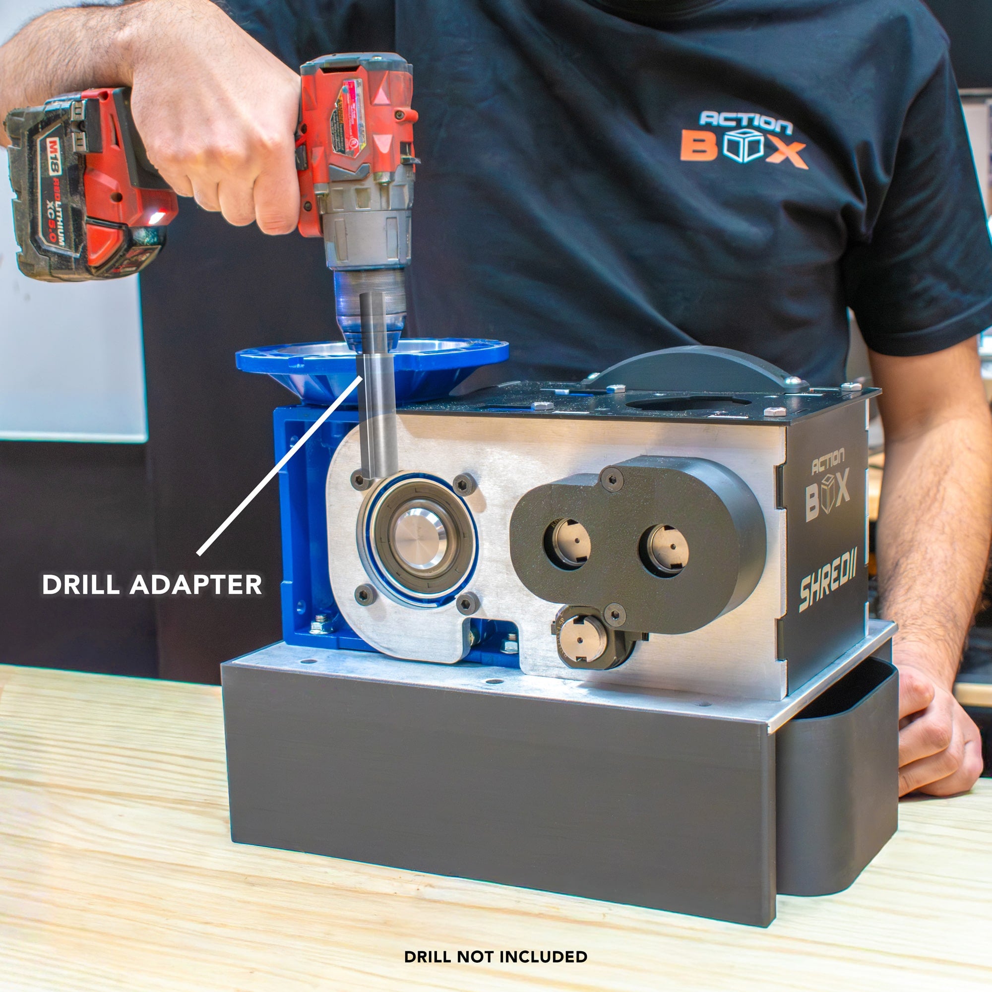 Using a drill to power SHREDII 8 with an adapter that allows you to use a drill instead of a motor on this desktop shredder by Action BOX.