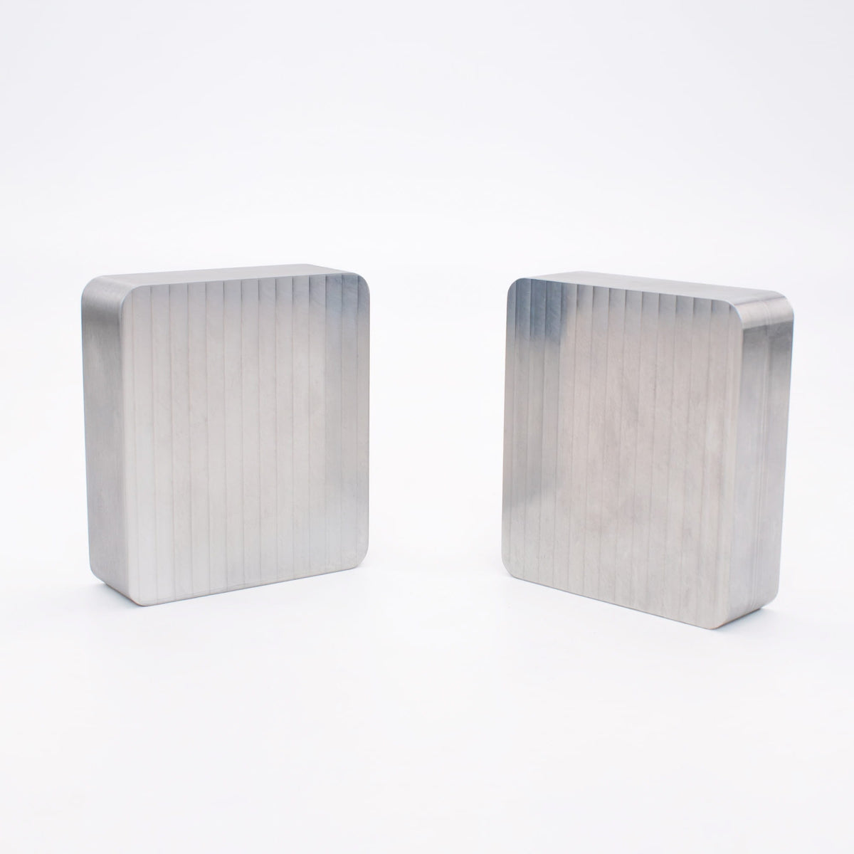 Two unmachined 6061-T6 aluminum mold blanks ready to be milled into custom injection molds.