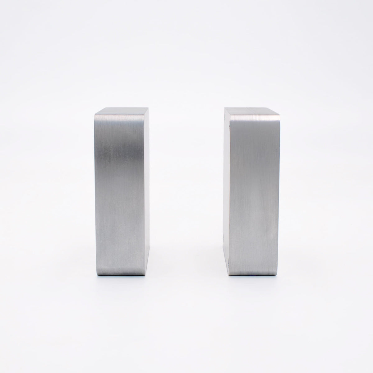 Side view of two aluminum mold blanks showing full plate thickness available for cavity depth.