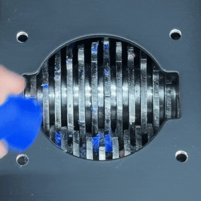 SHREDII 8 industrial-grade AR500 hardened steel blades shredding rigid plastic parts with precision and power.