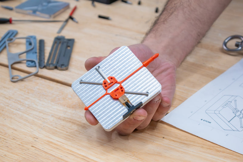 Aluminum metal plastic injection molded part made with Action BOX easy flow PP pellets using INJEKTO 3 desktop injection molder.