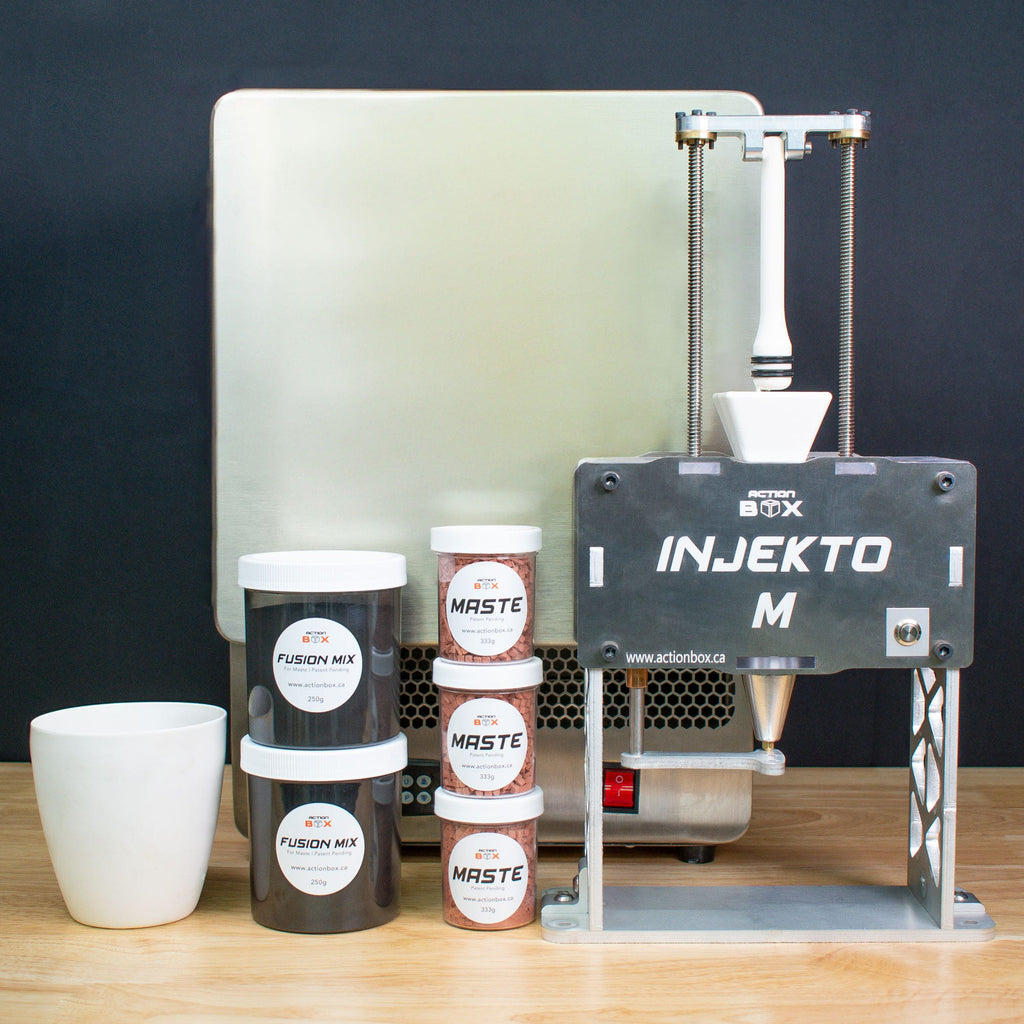 INJEKTO M or INJECTO M complete kit including a furnace, MASTE, FUSION MIX a white crucible. INJEKTO M is a metal injection molding machine used to make pure copper parts with Maste.