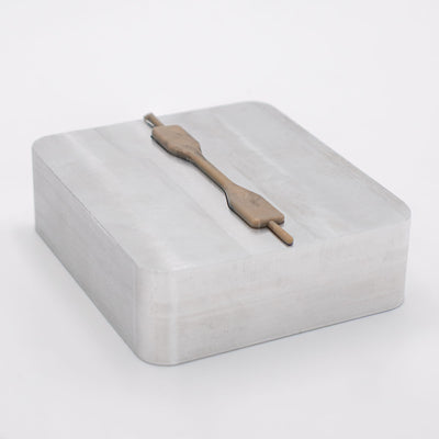 Dogbone PEEK plastic sample part on an aluminum mold made by Action BOX.
