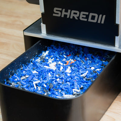 Add-on tray for plastic shreds on the SHREDII 8 Mechanical Kit by Action BOX. Mini industrial shredder used to shred plastic, bottles, metal compatible with a motor. Shredder for tough materials. The tray collects the plastic shreds for simplicity.