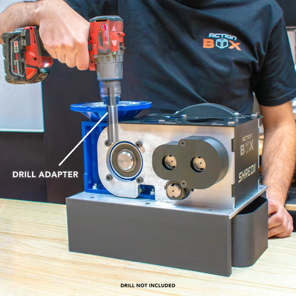 Using a drill to power SHREDII 8 with an adapter that allows you to use a drill instead of a motor on this desktop shredder by Action BOX.