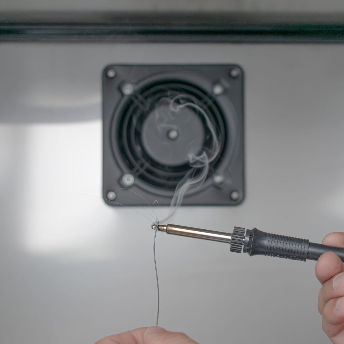 Soldering fume extraction into rear-mounted exhaust fan