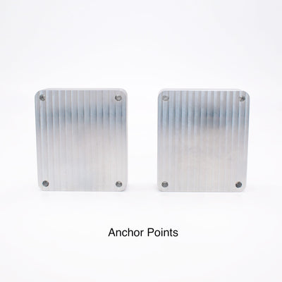 Back of two aluminum mold blanks showing four countersunk anchor points for rigid mold backer clamping.