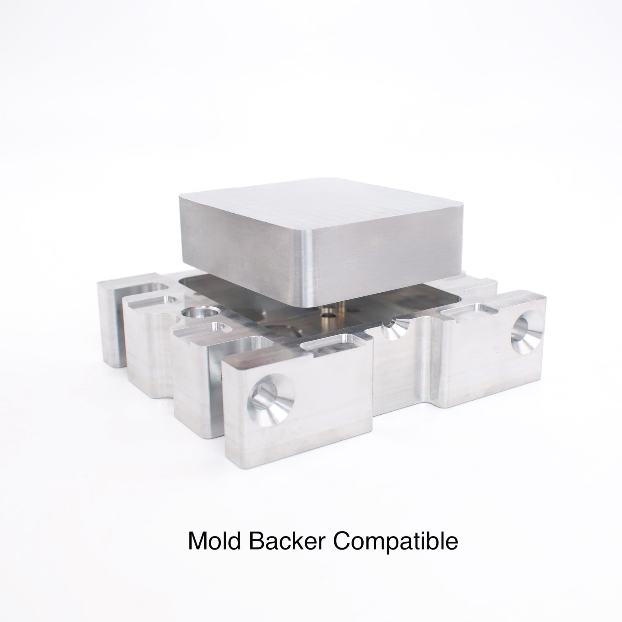 Aluminum mold blank seated on a mold backer, showing mold backer compatible mounting for injection molding.