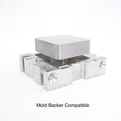 Aluminum mold blank seated on a mold backer, showing mold backer compatible mounting for injection molding.