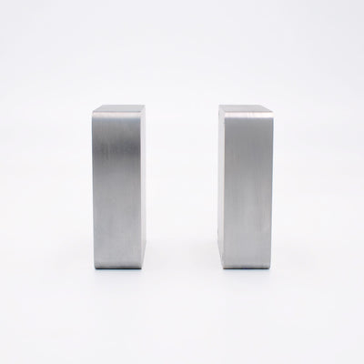 Side view of two aluminum mold blanks showing full plate thickness available for cavity depth.