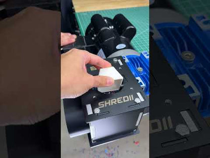 SHREDII 6 mini industrial shredder by Action BOX for shredding waste such as 3D prints, metal, cans and plastic bottles. It is powered by a hand crank or motor.